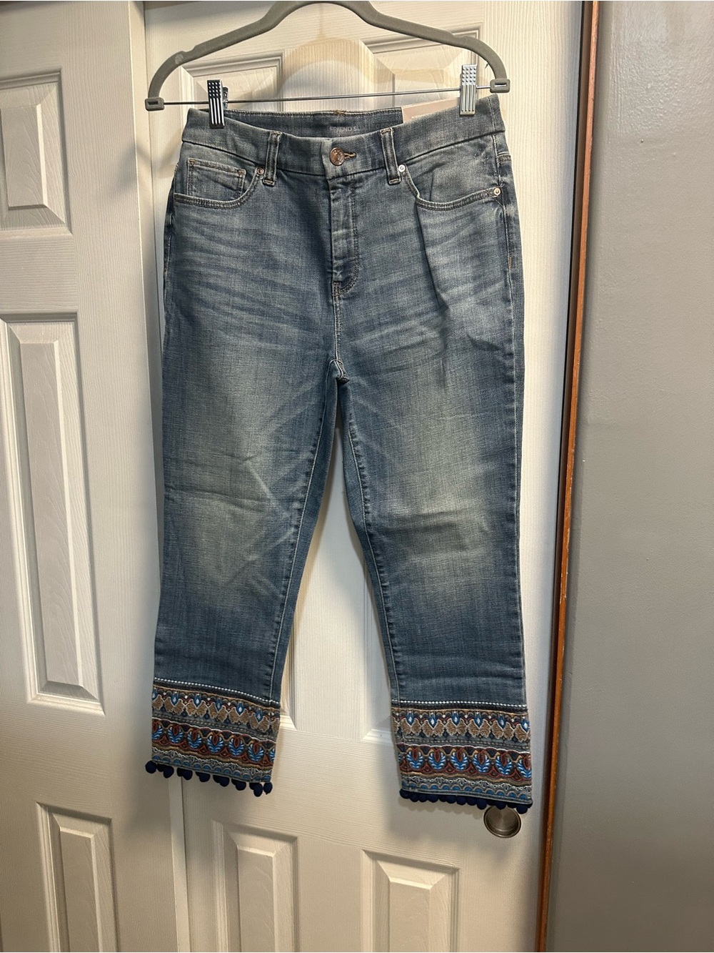 Chico's Medium Blue Cropped Jeans with Embroidered Hem and Navy Pom-Poms